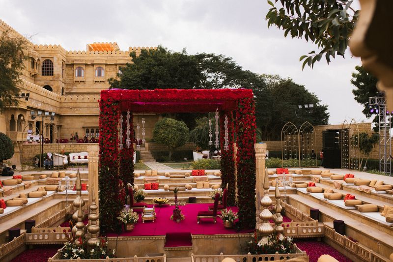 A red rose mandap built in the courtyard of a Rajasthan fort